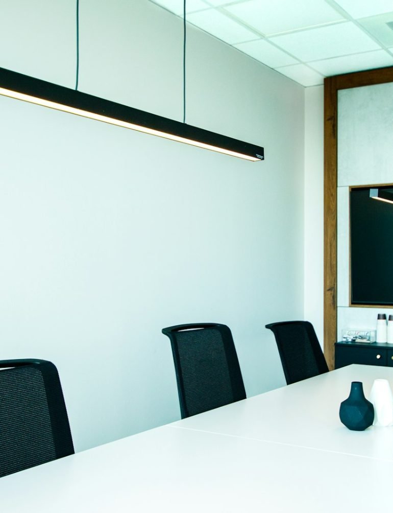 Modern conference room with display, Photo by Craig Lovelidge on Unsplash